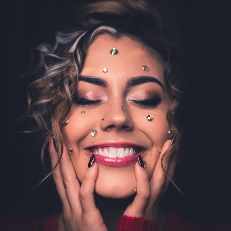 Ava Singh, Lead Design Curator at Corner Golden Signal, reviewing corporate floral arrangements